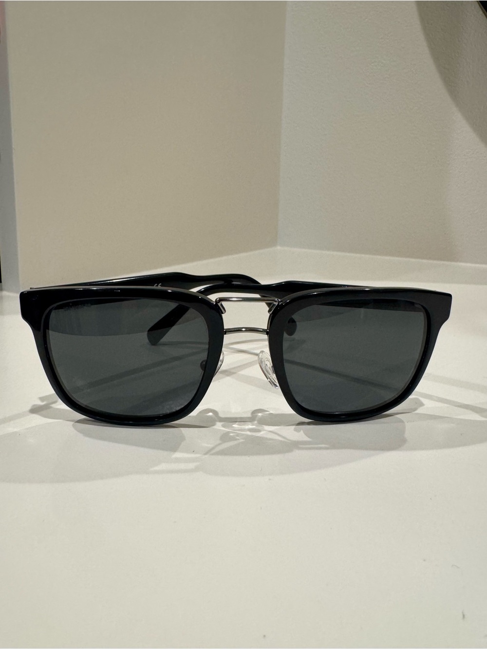 Prada SPR 14T Black unisex sunglasses with silver accents.